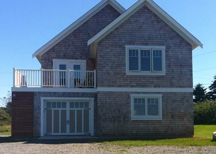 Eastman E-13, 9' x 7', Claystone door and Ice White overlays, 4 vertical lite Panoramic windows